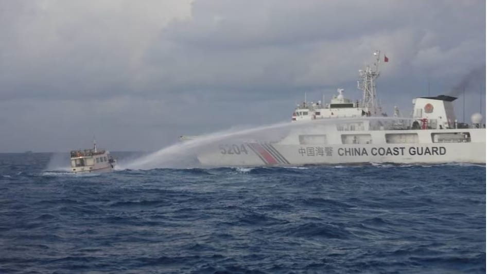 A Chinese Coast Guard ship uses a water cannon against a Filipino resupply vessel heading towards the disputed Second Thomas Shoal, in the South China Sea, December 10, 2023. (Reuters) A Chinese Coast Guard ship uses a water cannon against a Filipino resupply vessel heading towards the disputed Second Thomas Shoal, in the South China Sea, December 10, 2023. (Reuters)