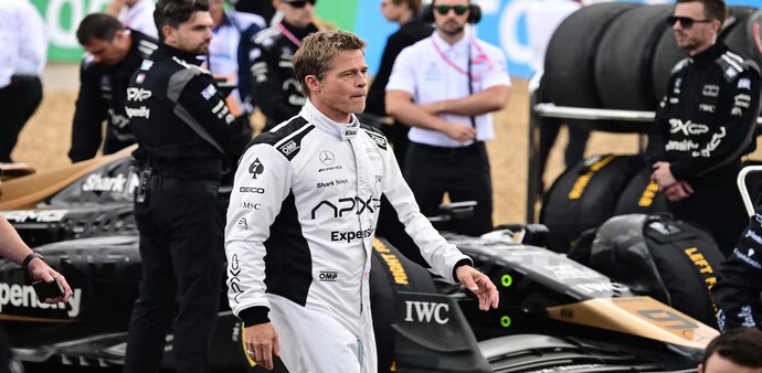 Formula One F1 - British Grand Prix - Silverstone Circuit, Silverstone, Britain - July 9, 2023 Actor Brad Pitt during the filming of an F1-inspired movie Pool via REUTERS/Christian Bruna Formula One F1 - British Grand Prix - Silverstone Circuit, Silverstone, Britain - July 9, 2023 Actor Brad Pitt during the filming of an F1-inspired movie Pool via REUTERS/Christian Bruna