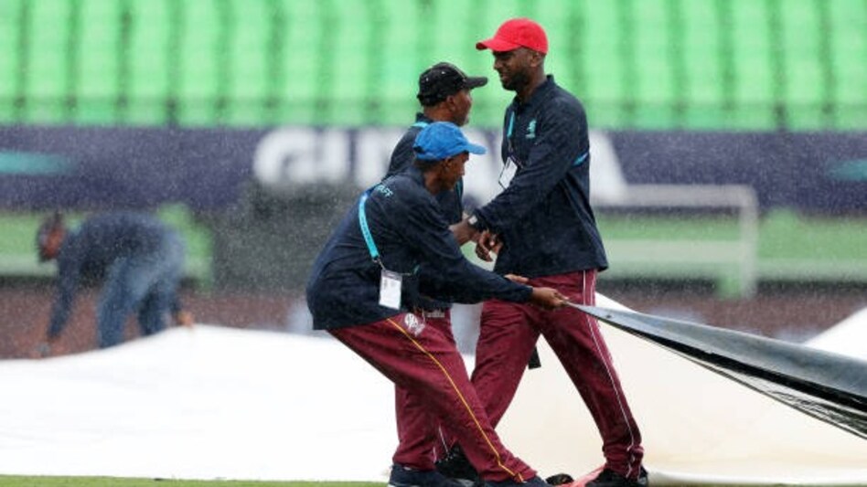 Groundstaff bring on the covers during the ICC Men's T20 Cricket World Cup Groundstaff bring on the covers during the ICC Men's T20 Cricket World Cup