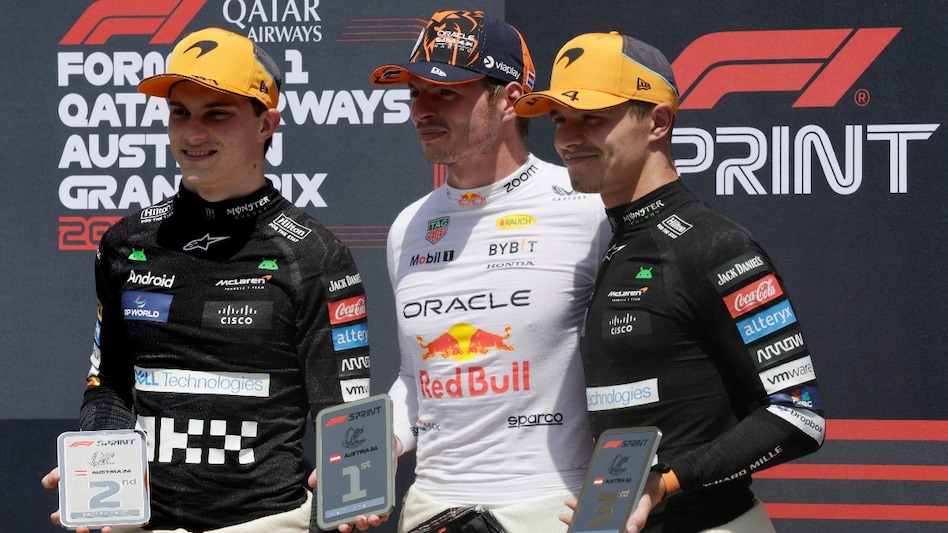 Red Bull's Max Verstappen celebrates after winning the sprint race with second placed McLaren's Oscar Piastri and third placed McLaren's Lando Norris Red Bull's Max Verstappen celebrates after winning the sprint race with second placed McLaren's Oscar Piastri and third placed McLaren's Lando Norris