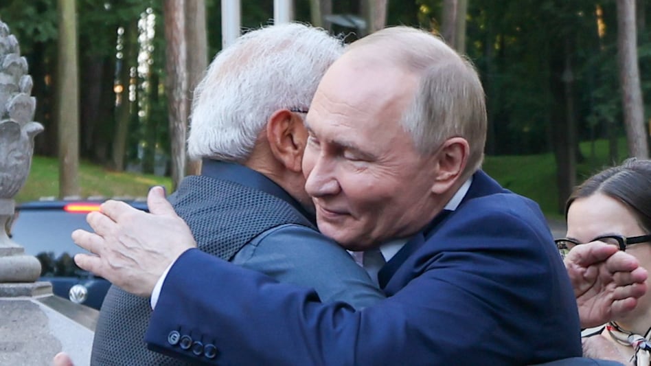 Russian President Vladimir Putin hugs PM Modi during his visit to his residence at Novo-Ogaryovo Russian President Vladimir Putin hugs PM Modi during his visit to his residence at Novo-Ogaryovo