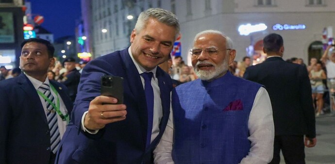 PM Modi, Austrian Chancellor Karl Nehammer take a selfie PM Modi, Austrian Chancellor Karl Nehammer take a selfie