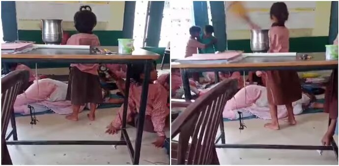 The video clip shows the principal comfortably sleeping on a mat on the floor of the classroom while a few students stand beside her, waving handheld fans to keep her cool. The video clip shows the principal comfortably sleeping on a mat on the floor of the classroom while a few students stand beside her, waving handheld fans to keep her cool.