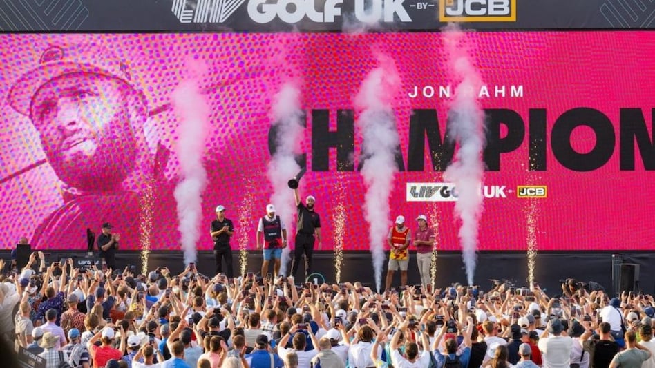 Legion XIII captain Jon Rahm celebrates his LIV Golf UK win with his caddie, Adam Hayes, next to second place finisher Joaquín Niemann of Torque GC and third place finisher Cameron Smith of Ripper GC in Rocester on Sunday. Legion XIII captain Jon Rahm celebrates his LIV Golf UK win with his caddie, Adam Hayes, next to second place finisher Joaquín Niemann of Torque GC and third place finisher Cameron Smith of Ripper GC in Rocester on Sunday.