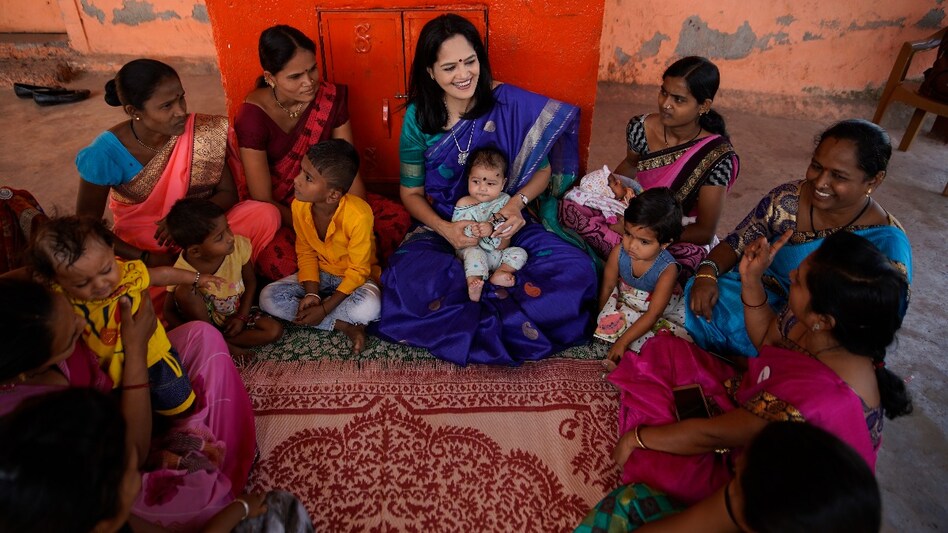 Dr. Aparna Hegde with beneficiaries and their children Dr. Aparna Hegde with beneficiaries and their children