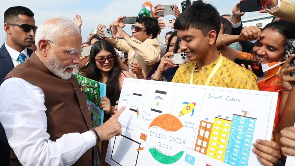 PM Modi interacts with members of Indian community as he arrived in the US for a 3-day visit. PM Modi interacts with members of Indian community as he arrived in the US for a 3-day visit.
