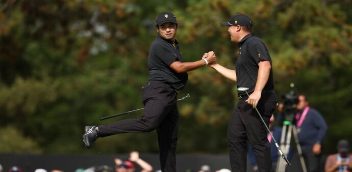 Hideki Matsuyama and Sungjae Im celebrate their 7&6 in the opening foursomes for the Internationals who ended Friday’s action level at 5-5 with defending champions USA at the Presidents Cup in Montreal. Image courtesy PGA Tour/Getty Images. Hideki Matsuyama and Sungjae Im celebrate their 7&6 in the opening foursomes for the Internationals who ended Friday’s action level at 5-5 with defending champions USA at the Presidents Cup in Montreal. Image courtesy PGA Tour/Getty Images.