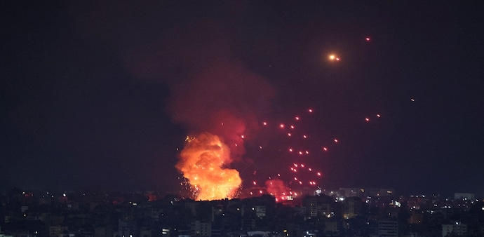 Smoke and flames rise over Beirut's southern suburbs after a strike, amid ongoing hostilities between Hezbollah and Israeli forces, as seen from Sin El Fil, Lebanon, October 6. Smoke and flames rise over Beirut's southern suburbs after a strike, amid ongoing hostilities between Hezbollah and Israeli forces, as seen from Sin El Fil, Lebanon, October 6.
