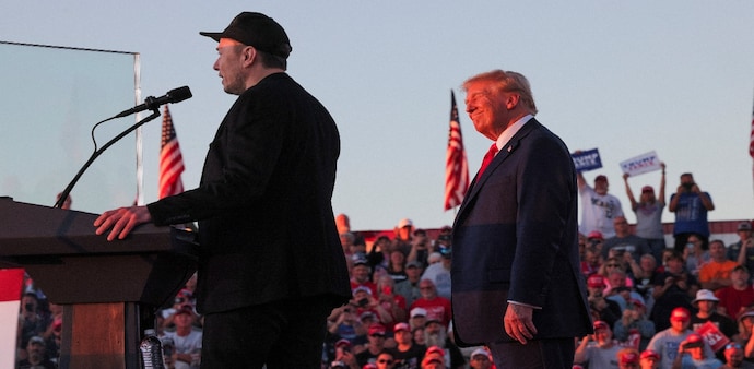Tesla CEO Elon Musk attends a rally by Republican presidential nominee former US President Donald Trump as he returned to the site of the assassination attempt against him, in Butler, Pennsylvania. Tesla CEO Elon Musk attends a rally by Republican presidential nominee former US President Donald Trump as he returned to the site of the assassination attempt against him, in Butler, Pennsylvania.