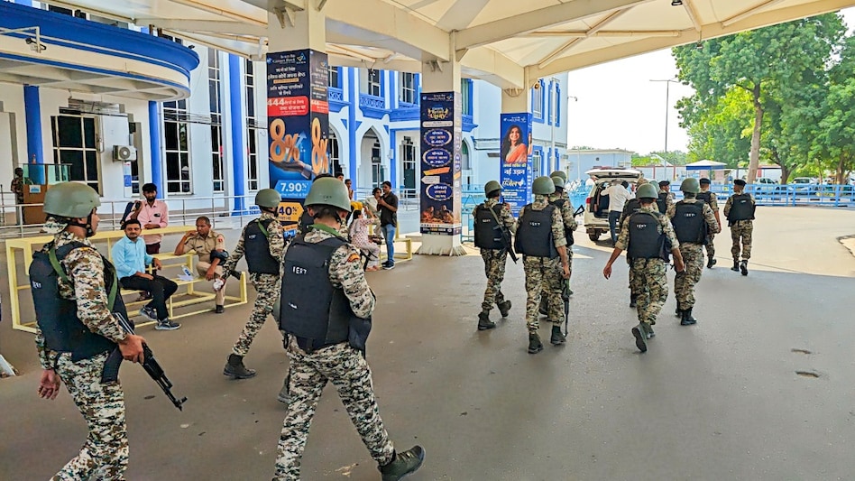 Security personnel keep a vigil after a flight made an emergency landing at the airport following an alleged bomb threat, in Jodhpur on October 20. Security personnel keep a vigil after a flight made an emergency landing at the airport following an alleged bomb threat, in Jodhpur on October 20.