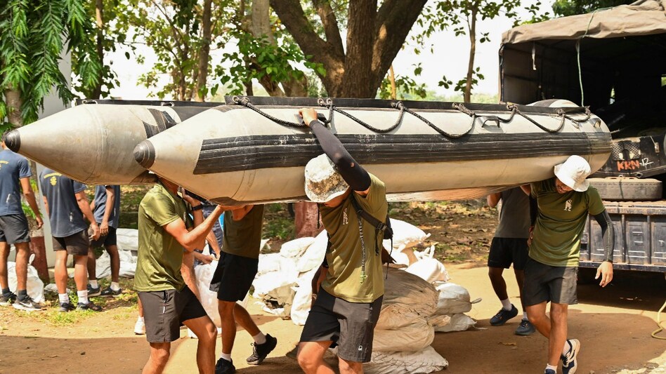 Navy personnel carry out preparations for disaster relief operations in view of cyclone ‘Dana’, which is expected to make landfall in Odisha on October 24. Navy personnel carry out preparations for disaster relief operations in view of cyclone ‘Dana’, which is expected to make landfall in Odisha on October 24.
