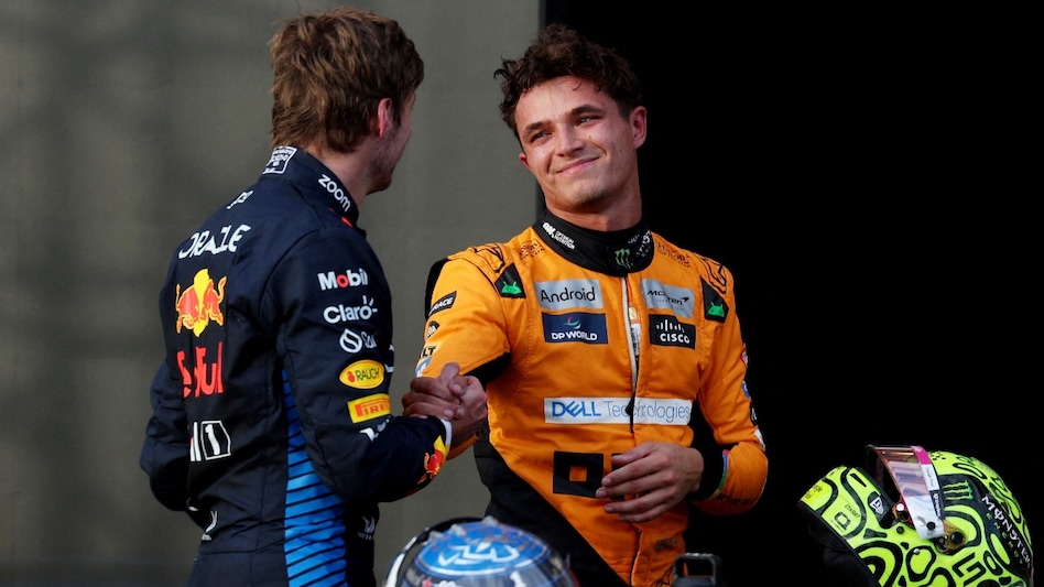McLaren's Lando Norris celebrates after qualifying in pole position with second placed Red Bull's Max Verstappen McLaren's Lando Norris celebrates after qualifying in pole position with second placed Red Bull's Max Verstappen