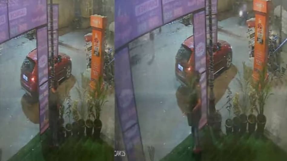 The video, which has gone viral, shows the woman parking her car near the society's entrance, getting out, and then casually picking up a flower pot from the premises The video, which has gone viral, shows the woman parking her car near the society's entrance, getting out, and then casually picking up a flower pot from the premises