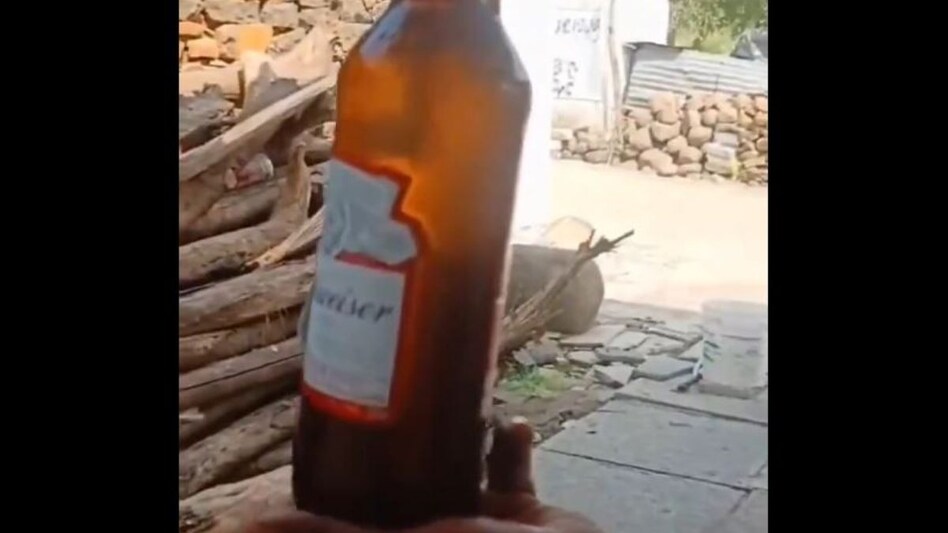 In Telangana's Vikarabad district, two men, Laxmikant Reddy and Anantaya, bought a beer bottle for a gathering in Kareli village but made a disturbing discovery—a dead lizard inside the bottle. In Telangana's Vikarabad district, two men, Laxmikant Reddy and Anantaya, bought a beer bottle for a gathering in Kareli village but made a disturbing discovery—a dead lizard inside the bottle.