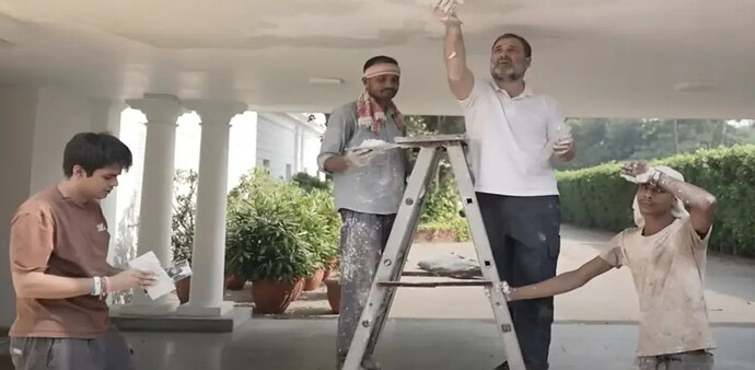 The video captured Gandhi at his 10, Janpath bungalow, where he attempted wall painting under the guidance of workers The video captured Gandhi at his 10, Janpath bungalow, where he attempted wall painting under the guidance of workers