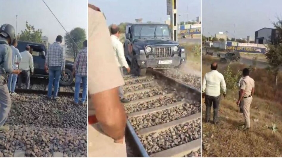 A video of the incident has gone viral, showing the man trying to move the car with the help of some people and police officers standing nearby. A video of the incident has gone viral, showing the man trying to move the car with the help of some people and police officers standing nearby.