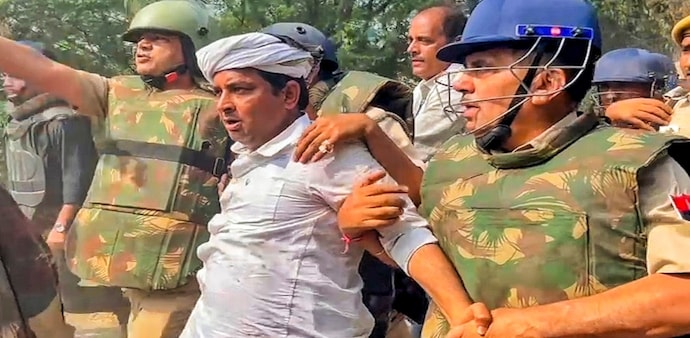 Meena’s arrest follows a chaotic confrontation with police, leaving vehicles torched and dozens detained in the wake of election-day violence. Meena’s arrest follows a chaotic confrontation with police, leaving vehicles torched and dozens detained in the wake of election-day violence.