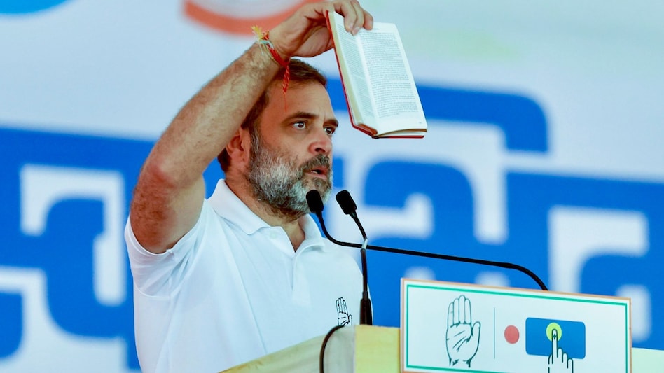 Rahul Gandhi shows a copy of the Constitution during a rally in Maharashtra's Nandurbar. (PTI photo) Rahul Gandhi shows a copy of the Constitution during a rally in Maharashtra's Nandurbar. (PTI photo)
