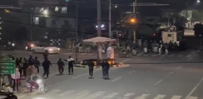 Security forces resort to blank fire, tear gas near BJP MLA's residence in Imphal. Security forces resort to blank fire, tear gas near BJP MLA's residence in Imphal.