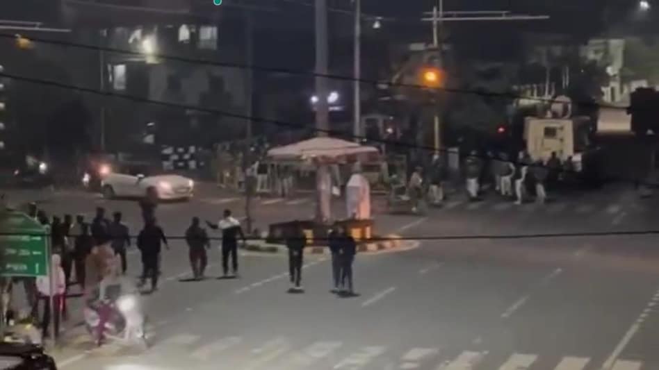 Security forces resort to blank fire, tear gas near BJP MLA's residence in Imphal. Security forces resort to blank fire, tear gas near BJP MLA's residence in Imphal.