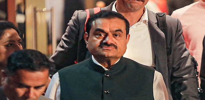 S&P Global said the US indictment raised questions regarding the management and governance of various Adani group entities, adding the US indictment is independent of, but follows, Hindenburg Research's report. S&P Global said the US indictment raised questions regarding the management and governance of various Adani group entities, adding the US indictment is independent of, but follows, Hindenburg Research's report.