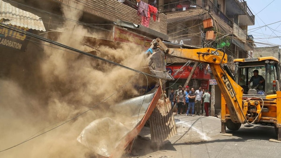 The demolition has sparked widespread protests, drawing criticism from political parties and Kashmiri Pandit organisations. The demolition has sparked widespread protests, drawing criticism from political parties and Kashmiri Pandit organisations.
