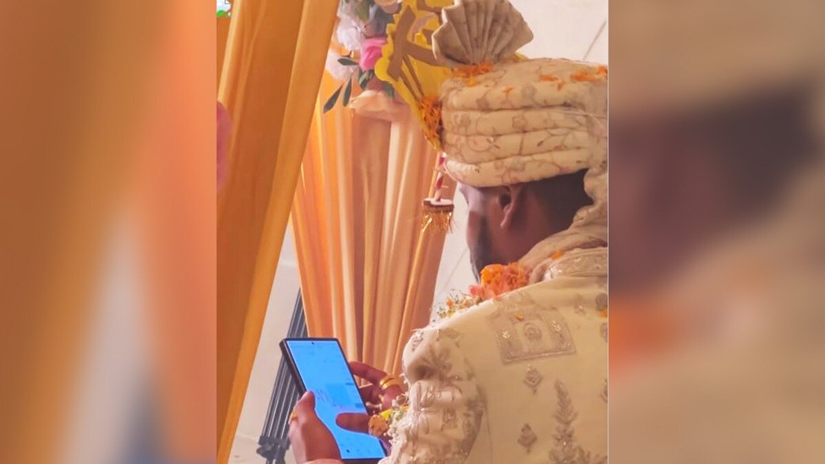 The video, which has gone viral on social media platforms, shows the groom sitting at the mandap, surrounded by guests and well-wishers. The video, which has gone viral on social media platforms, shows the groom sitting at the mandap, surrounded by guests and well-wishers.