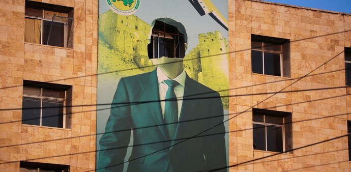 A damaged poster of Syria’s President Bashar al-Assad in Aleppo, after the city was captured by rebels who swept into the city on November 30. (Reuters) A damaged poster of Syria’s President Bashar al-Assad in Aleppo, after the city was captured by rebels who swept into the city on November 30. (Reuters)