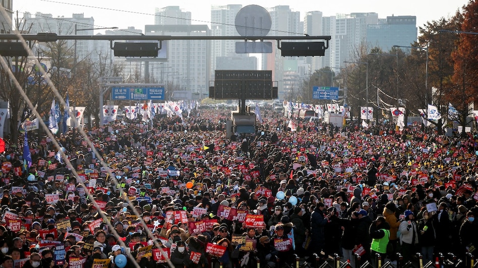 Protesters participate in a rally calling for the impeachment of South Korean President Yoon Suk Yeol in front of the National Assembly in Seoul on December 14. Protesters participate in a rally calling for the impeachment of South Korean President Yoon Suk Yeol in front of the National Assembly in Seoul on December 14.