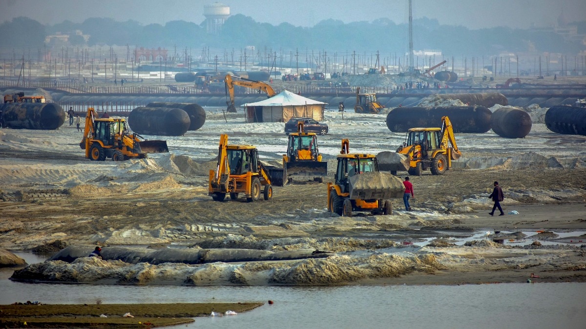 Excavators being used to level the surface along the banks of the Ganga as part of preparations for the Maha Kumbh Mela 2025 in Prayagraj. Excavators being used to level the surface along the banks of the Ganga as part of preparations for the Maha Kumbh Mela 2025 in Prayagraj.