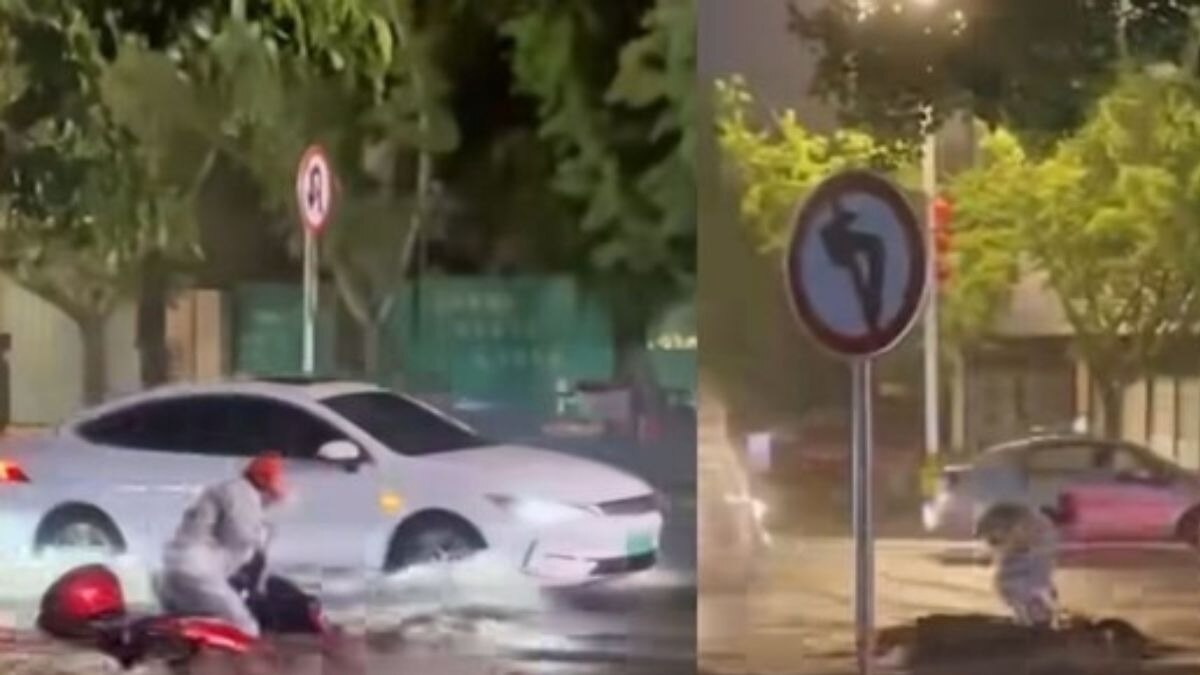 The scene grows increasingly tense as the powerful water currents push the motorcyclist backward, leaving him unable to move his bike. The scene grows increasingly tense as the powerful water currents push the motorcyclist backward, leaving him unable to move his bike.