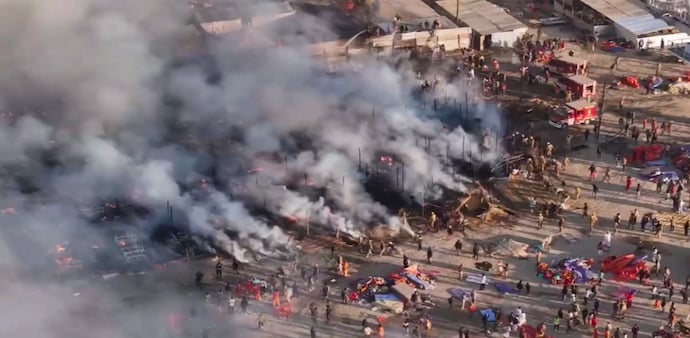 A drone shot shows smoke coming out after a fire broke out in a camp during Mahakumbh at Sangam in Prayagraj on January 19. A drone shot shows smoke coming out after a fire broke out in a camp during Mahakumbh at Sangam in Prayagraj on January 19.