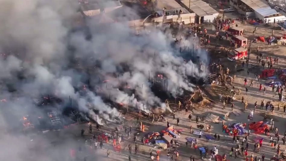 A drone shot shows smoke coming out after a fire broke out in a camp during Mahakumbh at Sangam in Prayagraj on January 19. A drone shot shows smoke coming out after a fire broke out in a camp during Mahakumbh at Sangam in Prayagraj on January 19.