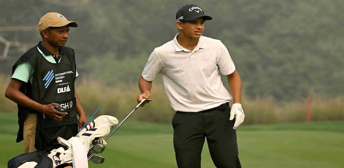 Teenaged amateur Kartik Singh studies a shot on day three of the International Series India presented by DLF where he has scripted some history. (Image courtesy: Asian Tour) Teenaged amateur Kartik Singh studies a shot on day three of the International Series India presented by DLF where he has scripted some history. (Image courtesy: Asian Tour)