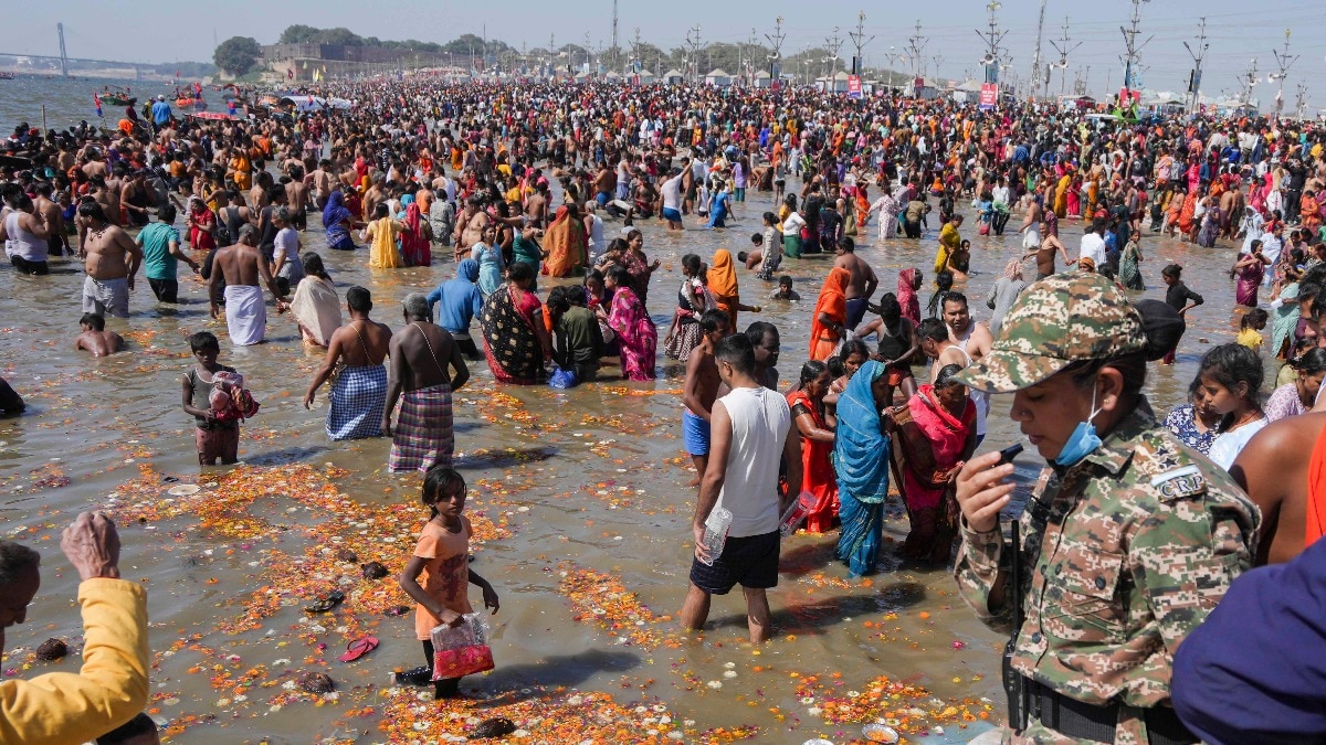 Devotees take a holy dip in Ganga river during the Maha Kumbh Mela Devotees take a holy dip in Ganga river during the Maha Kumbh Mela