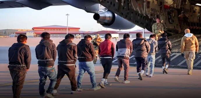 Indian deportees boarding a flight in the US. File Indian deportees boarding a flight in the US. File