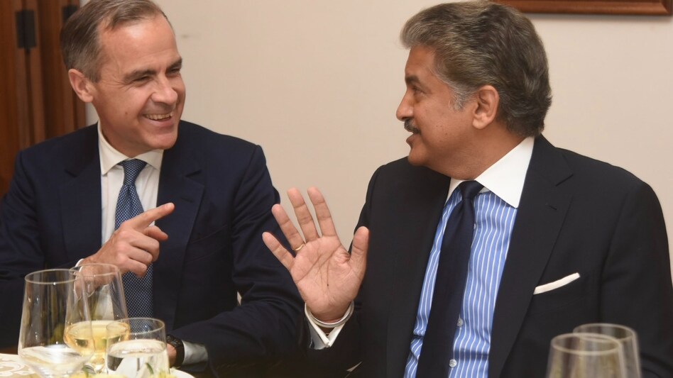 Anand Mahindra with Mark Carney in 2017 Anand Mahindra with Mark Carney in 2017