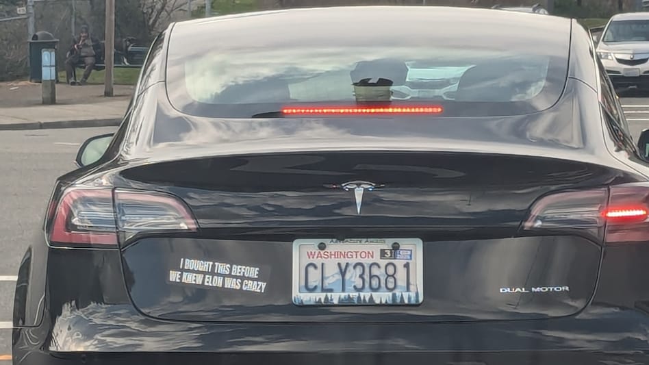 The Tesla car with the bumper sticker in Seattle The Tesla car with the bumper sticker in Seattle