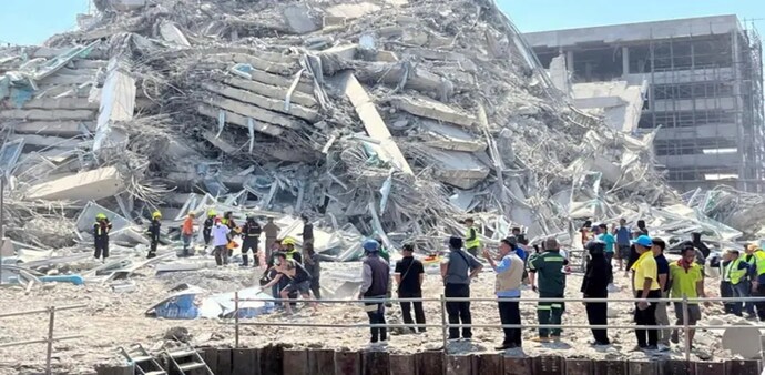 In Bangkok, a 30-story building under construction collapsed, trapping 43 workers, according to police and medical officials. In Bangkok, a 30-story building under construction collapsed, trapping 43 workers, according to police and medical officials.