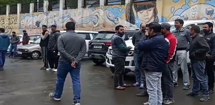 People run out of a building in Kashmir following the earthquake. People run out of a building in Kashmir following the earthquake.