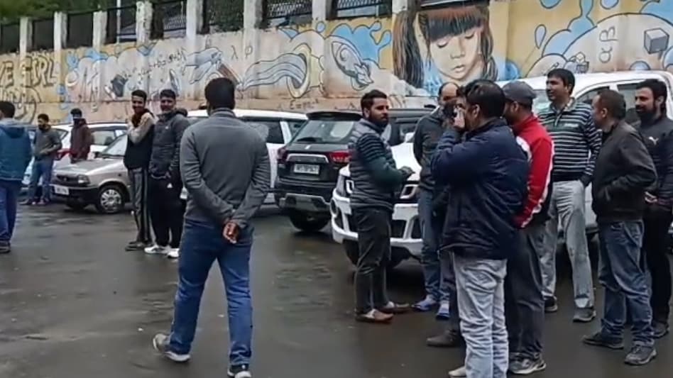 People run out of a building in Kashmir following the earthquake. People run out of a building in Kashmir following the earthquake.