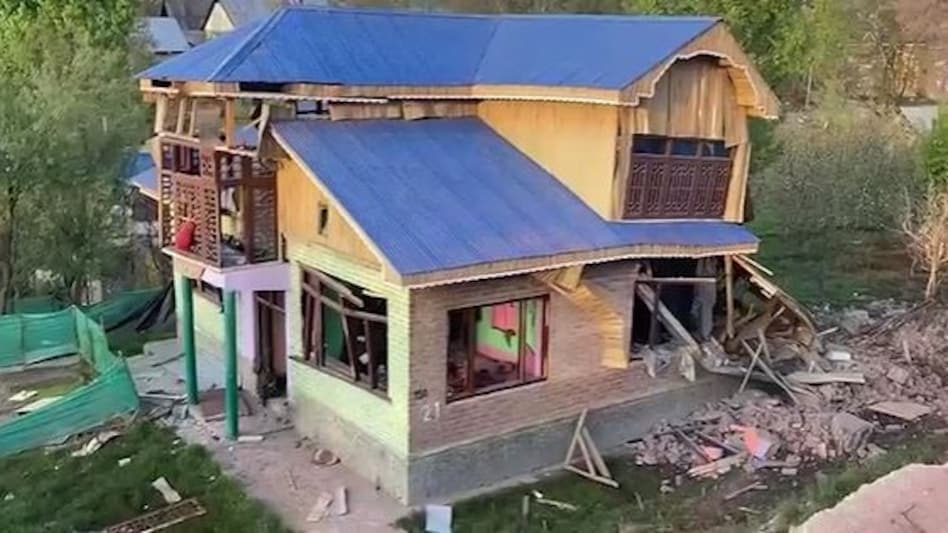 A double-storey house belonging to Ahsan Ahmad Sheikh, an active LeT terrorists, was destroyed using IEDs. A double-storey house belonging to Ahsan Ahmad Sheikh, an active LeT terrorists, was destroyed using IEDs.