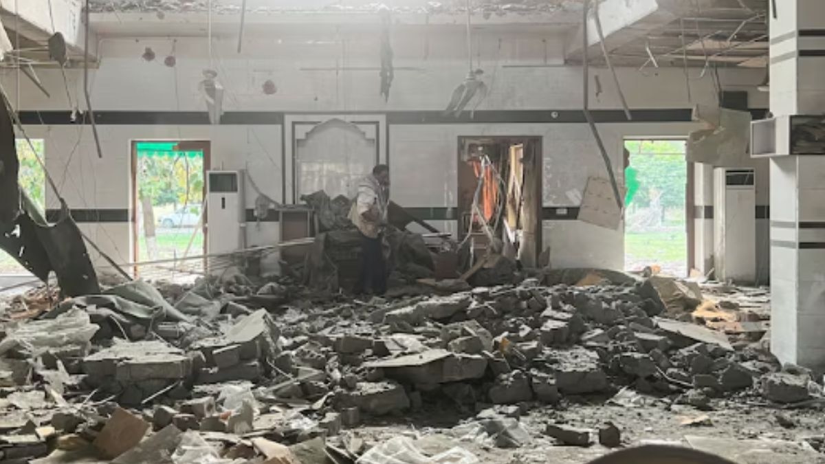 ]A man walks inside a mosque after it was hit by an Indian strike, in Muridke near Lahore, Pakistan May 7, 2025