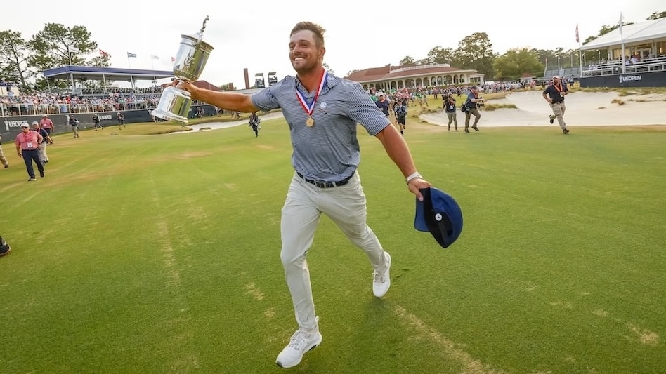 Bryson DeChambeau celebrates his second US Open win at Pinehurst last year after winning it for the first time in 2020 at Winged Foot. Image courtesy usopen.com. Bryson DeChambeau celebrates his second US Open win at Pinehurst last year after winning it for the first time in 2020 at Winged Foot. Image courtesy usopen.com.