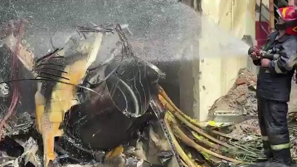 TV footage captured fire and thick black smoke from a crash site, prompting rescue teams to rush injured individuals to six hospitals. TV footage captured fire and thick black smoke from a crash site, prompting rescue teams to rush injured individuals to six hospitals.