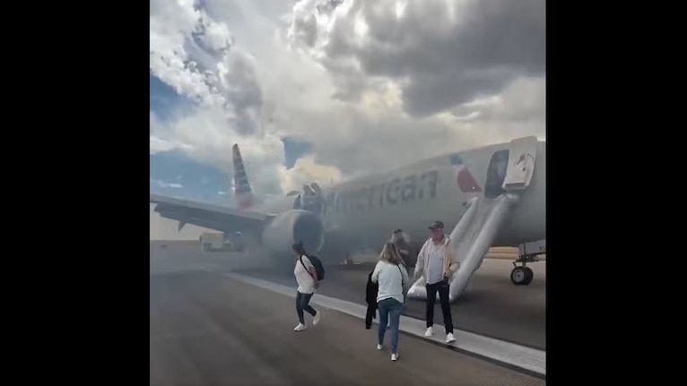 American Airlines Boeing 737 with over 150 passengers catches fire at Denver Airport; WATCH