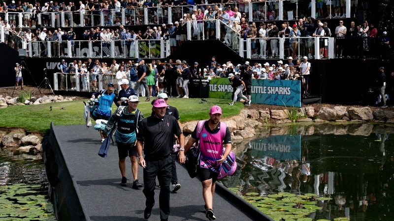 RangeGoats captain Bubba Watson and caddie Kyle Peters on the first hole during the second round of LIV Golf UK by JCB in Rocester. Image courtesy LIV Golf.