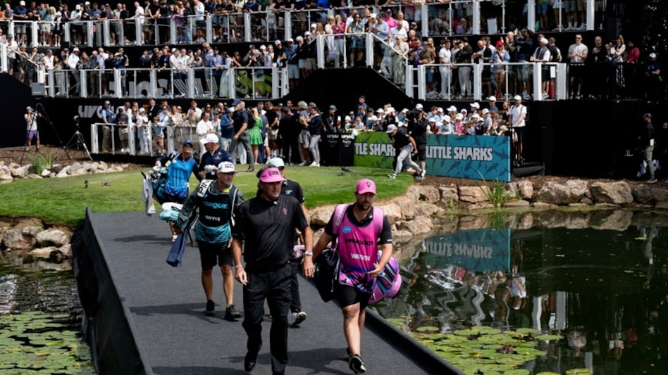 RangeGoats captain Bubba Watson and caddie Kyle Peters on the first hole during the second round of LIV Golf UK by JCB in Rocester. Image courtesy LIV Golf. RangeGoats captain Bubba Watson and caddie Kyle Peters on the first hole during the second round of LIV Golf UK by JCB in Rocester. Image courtesy LIV Golf.
