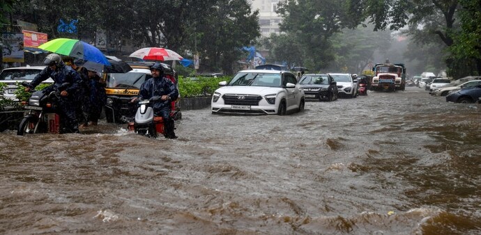 Intermittent showers lashed Mumbai overnight, but rain intensity eased on Wednesday morning, restoring normalcy a day after torrential rains battered the city. Intermittent showers lashed Mumbai overnight, but rain intensity eased on Wednesday morning, restoring normalcy a day after torrential rains battered the city.