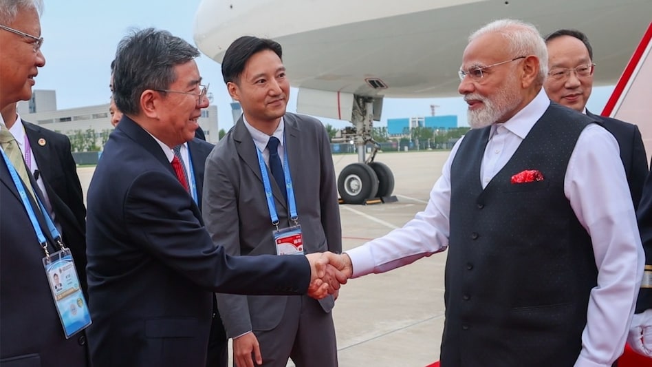 Chinese officials welcome PM Modi upon his arrival in Tianjin on August 30. Chinese officials welcome PM Modi upon his arrival in Tianjin on August 30.